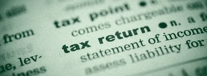 Close up of the words tax return in a dictionary