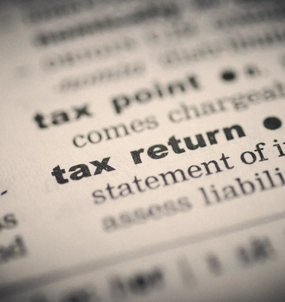 Close up of the words tax return in a dictionary