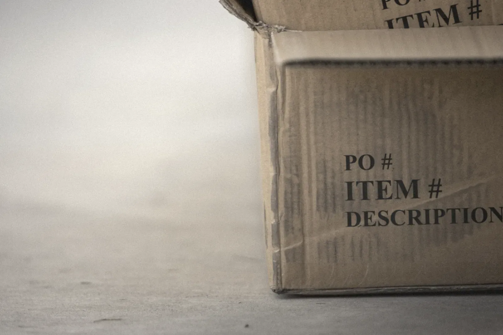 A cardboard box labeled for inventory