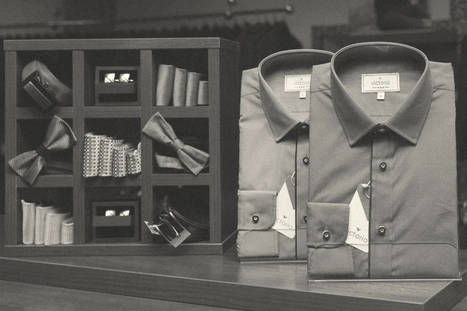 Folded shirts on display shelves in a store