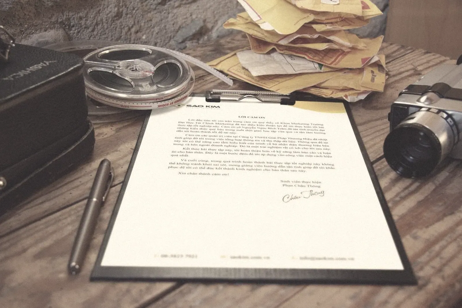 A signed document on a clipboard on a desk
