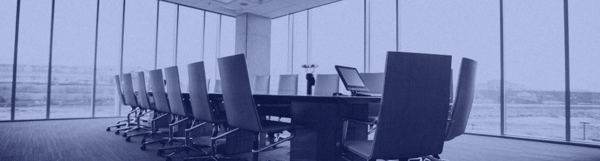 An empty conference room with a long table
